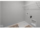A functional laundry area with essential connections and a wire shelf for storage at 4183 Douro Trl, Westfield, IN 46062