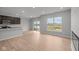 Bright living space boasts wood floors, a view of the yard, and an open layout to the kitchen at 4183 Douro Trl, Westfield, IN 46062