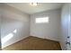 Spacious bedroom with neutral walls and brown carpet at 4820 E 70Th St, Indianapolis, IN 46220