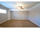 Spacious bedroom with ceiling fan and built-in shelving at 4820 E 70Th St, Indianapolis, IN 46220