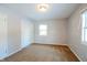 Well-lit bedroom with double doors and carpet flooring at 4820 E 70Th St, Indianapolis, IN 46220