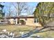 Brick ranch home with a large yard and mature trees at 4820 E 70Th St, Indianapolis, IN 46220