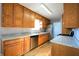 Kitchen featuring oak cabinets, granite countertops, and stainless steel appliances at 4820 E 70Th St, Indianapolis, IN 46220