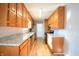 Oak kitchen cabinets, granite countertops, and stainless steel appliances at 4820 E 70Th St, Indianapolis, IN 46220