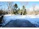 Large concrete patio in backyard, partially covered with snow at 4820 E 70Th St, Indianapolis, IN 46220