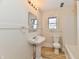 Bathroom with pedestal sink, toilet and bathtub at 4992 W 100 S, New Palestine, IN 46163