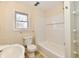 Clean bathroom with a tub and updated fixtures at 4992 W 100 S, New Palestine, IN 46163