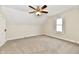 Charming attic bedroom with window, ceiling fan and carpet at 4992 W 100 S, New Palestine, IN 46163