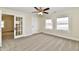 Spacious bedroom with french doors and neutral decor at 4992 W 100 S, New Palestine, IN 46163