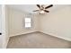 Bright bedroom with a window and ceiling fan at 4992 W 100 S, New Palestine, IN 46163