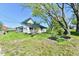 Quaint two-story home with a covered side porch and mature trees at 4992 W 100 S, New Palestine, IN 46163