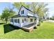 Beautifully maintained two-story home with a green roof and a well manicured lawn at 4992 W 100 S, New Palestine, IN 46163