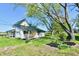 Charming two-story home with a side porch and large, mature trees in the yard at 4992 W 100 S, New Palestine, IN 46163
