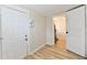 Bright hallway with light walls and wood-look floors at 4992 W 100 S, New Palestine, IN 46163