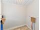 Simple laundry room with vinyl flooring and water heater at 4992 W 100 S, New Palestine, IN 46163