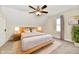 Virtually staged main bedroom with wood bed frame and neutral decor at 4992 W 100 S, New Palestine, IN 46163