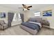 Main bedroom with virtually staged bed and sitting area at 4992 W 100 S, New Palestine, IN 46163