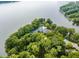 Lakefront property with a large house and lush landscaping at 5101 Green Braes E Dr, Indianapolis, IN 46234
