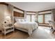 Serene bedroom with white bedding and large windows at 5101 Green Braes E Dr, Indianapolis, IN 46234
