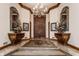 Grand entryway with chandelier and ornate mirrors at 5101 Green Braes E Dr, Indianapolis, IN 46234