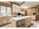Island kitchen with granite countertops and stainless steel appliances at 5101 Green Braes E Dr, Indianapolis, IN 46234