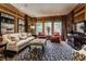Cozy living room featuring a comfortable sofa and built-in shelving at 5101 Green Braes E Dr, Indianapolis, IN 46234