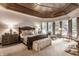 Luxurious main bedroom with a cozy sitting area and large windows at 5101 Green Braes E Dr, Indianapolis, IN 46234