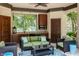 Outdoor kitchen with seating area and lake view at 5101 Green Braes E Dr, Indianapolis, IN 46234