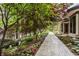 Landscaped walkway leading to a home with water feature at 5101 Green Braes E Dr, Indianapolis, IN 46234