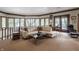 Comfortable sitting area with leather furniture and lake view at 5101 Green Braes E Dr, Indianapolis, IN 46234