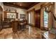 Home wet bar with wood cabinetry, granite countertops, and wine storage at 5101 Green Braes E Dr, Indianapolis, IN 46234