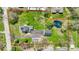 Aerial view of property surrounded by a red line showing the pond, buildings, and landscape at 5420 Mcfarland Rd, Indianapolis, IN 46227