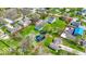 Aerial view of a property showing a large lot, mature trees, a pond with fountain, and a house at 5420 Mcfarland Rd, Indianapolis, IN 46227