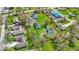 Aerial view of a property showing a large lot, mature trees, a pond, and a house at 5420 Mcfarland Rd, Indianapolis, IN 46227