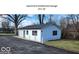 Apartment with attached garage featuring white siding and a driveway at 5420 Mcfarland Rd, Indianapolis, IN 46227