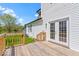 View of a home's back porch featuring wood floors, railing, and white siding at 5420 Mcfarland Rd, Indianapolis, IN 46227