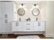 Bathroom with double vanity, cabinets, and decorative mirrors at 5420 Mcfarland Rd, Indianapolis, IN 46227
