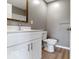 Clean bathroom featuring modern vanity, toilet, and stylish flooring at 5420 Mcfarland Rd, Indianapolis, IN 46227