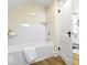 Bathroom featuring a tub, shower, and a white door at 5420 Mcfarland Rd, Indianapolis, IN 46227