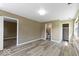 Spacious bedroom featuring neutral tones, wood-look flooring, and ample natural light at 5420 Mcfarland Rd, Indianapolis, IN 46227