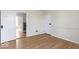 Bedroom showcasing a doorway with bright hardwood floors and white paint at 5420 Mcfarland Rd, Indianapolis, IN 46227