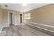 Large bedroom showcasing modern wood-look flooring and freshly painted walls at 5420 Mcfarland Rd, Indianapolis, IN 46227