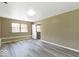 A bedroom with neutral walls, and modern wood floors at 5420 Mcfarland Rd, Indianapolis, IN 46227