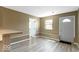 Inviting entryway leading into the living space with neutral colors at 5420 Mcfarland Rd, Indianapolis, IN 46227