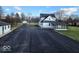 Exterior view of home showing long driveway, screened porch, and guest house at 5420 Mcfarland Rd, Indianapolis, IN 46227