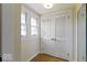 Hallway with a closet, windows, and hardwood floors at 5420 Mcfarland Rd, Indianapolis, IN 46227