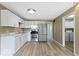 Bright kitchen featuring white cabinets, stainless steel appliances, and modern countertops at 5420 Mcfarland Rd, Indianapolis, IN 46227