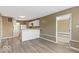 Open-concept kitchen featuring white appliances and bar seating at 5420 Mcfarland Rd, Indianapolis, IN 46227