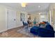 Cozy living room with a blue couch, colorful rug, and bright light at 5420 Mcfarland Rd, Indianapolis, IN 46227