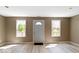 Bright, open living room with large windows and a welcoming entrance at 5420 Mcfarland Rd, Indianapolis, IN 46227